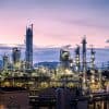 Petroleum plant on sky twilight background showing Iranian hackers APT33 threatening ICS security