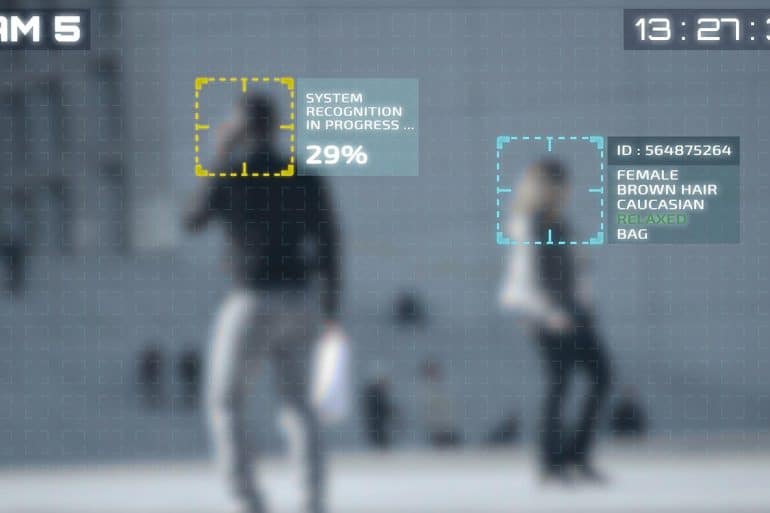 Facial recognition technology running on people in city showing the NIST face recognition study which found that algorithms vary greatly between software vendors