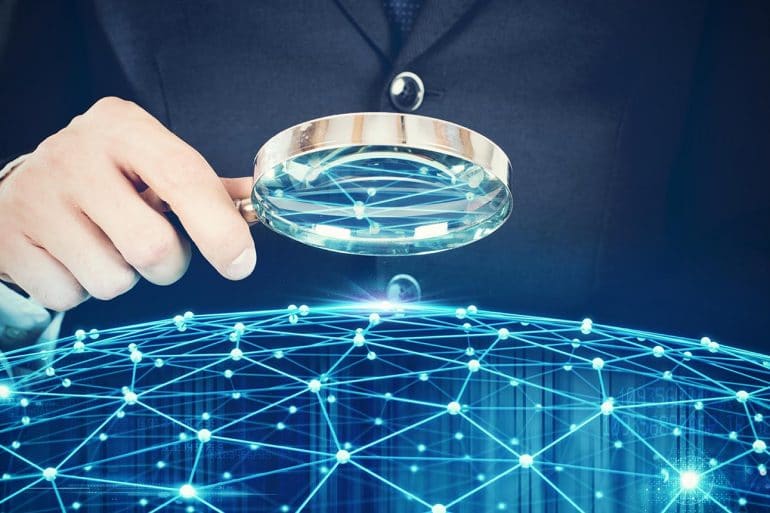 Man holding magnifying glass over a virtual network map showing Facebook not changing web tracking practices as they believe CCPA does not apply to them