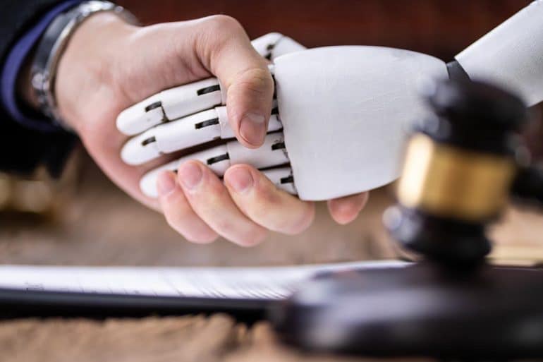 Robot shaking hands with judge near gavel showing the need for AI regulation