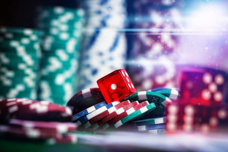Poker Chips in casino gamble green table showing the need for security for online sports betting