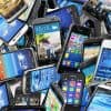 Pile of smartphones showing the pre-installed malware that comes with U.S. government-funded Android phones