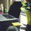 Laptop on home desk showing what companies must do to secure data as workers transition to working from home in a pandemic