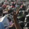 Indian man making victory sign in a crowd of people showing privacy advocates voicing opposition against India’s proposed national data protection law