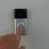 Man pressing a doorbell showing Amazon Ring assessing user demand for facial recognition feature in their products