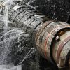 A broken pipe leaking water showing how data loss can occur