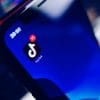Tiktok application icon on mobile showing the proposed bill to issue national security warning labels for apps