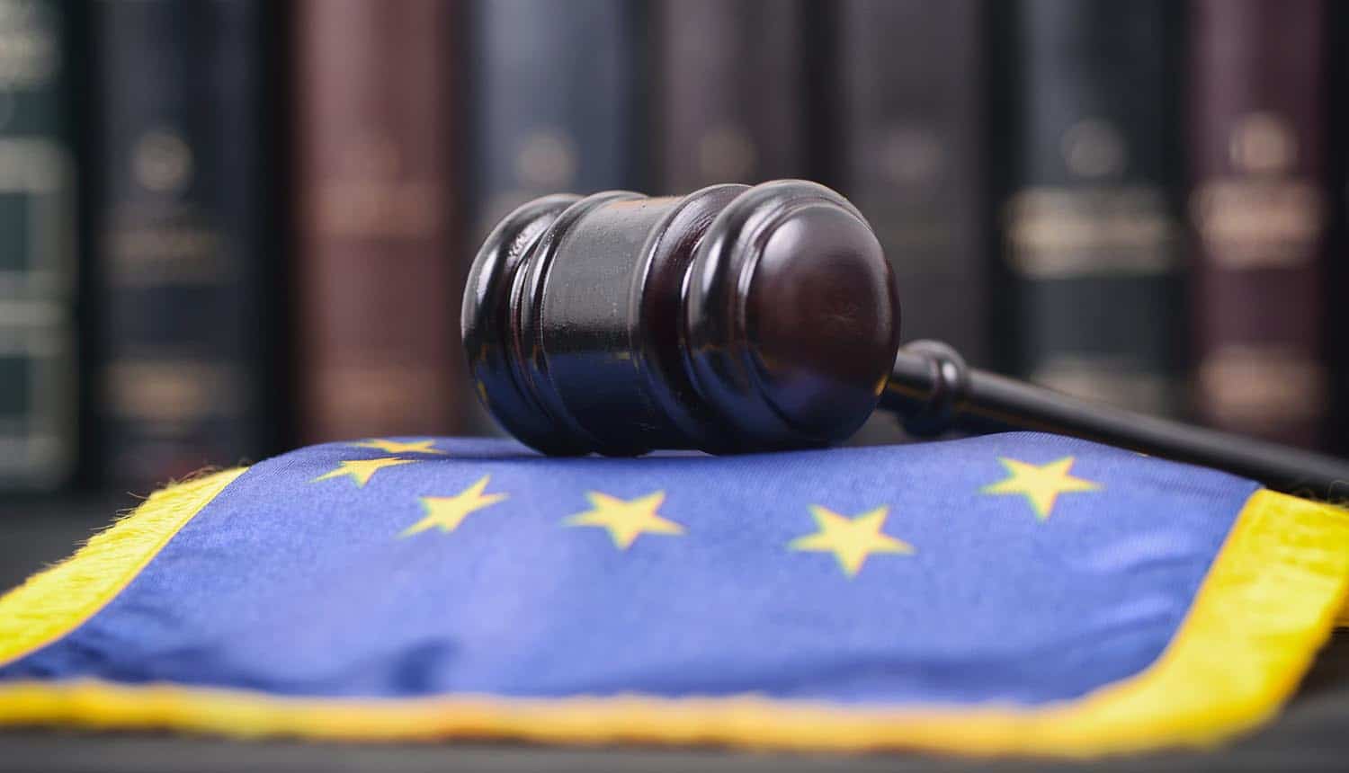 Gavel on EU flag showing the EDRi letter that highlights the disparity in GDPR enforcement actions and lack of resources to DPA