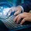Man typing on keyboard with virtual global map showing the new guidelines released by French privacy watchdog on web scraping for direct marketing