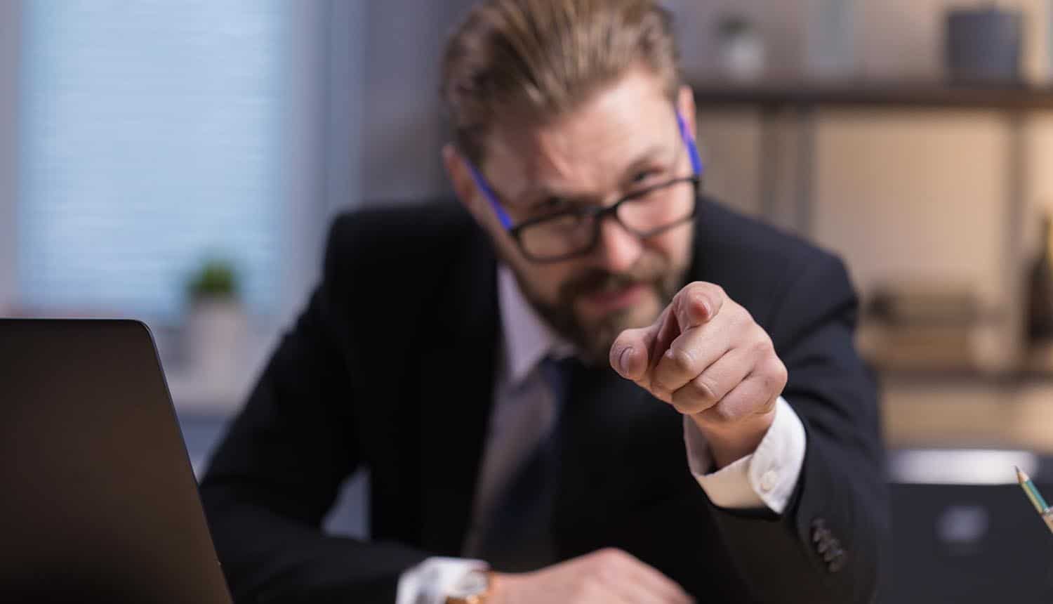 Businessman with a pointing finger showing consumers want CEOs to be punished if ransomware attacks were to affect them