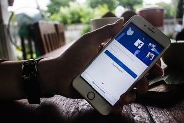 Facebook login page on mobile showing Facebook suing two websites for data scraping