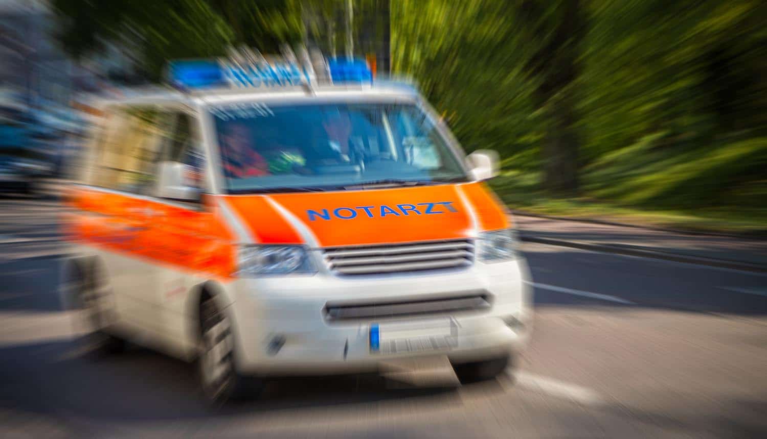 German emergency ambulance car drives on the street showing ransomware attack on German hospital