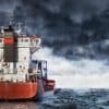 Cargo ship at sea during a storm showing business risk of cyber attacks