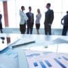 Executives discussing boardroom decisions on cyber investments