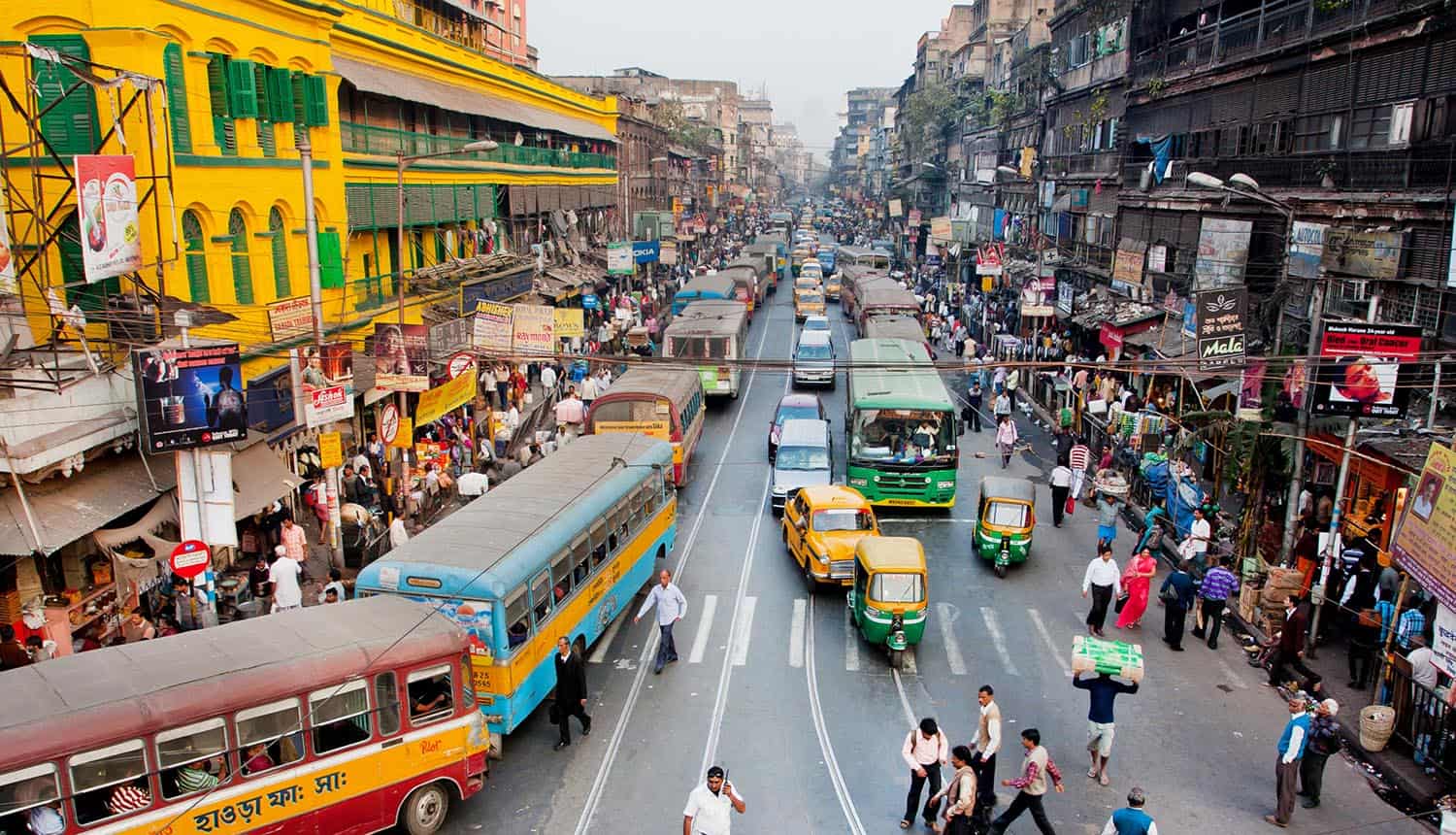 Pedestrians cross the road in India showing impact of data breach on payment processor