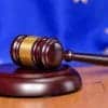 EU flag on the background of the judges gavel showing GDPR fines