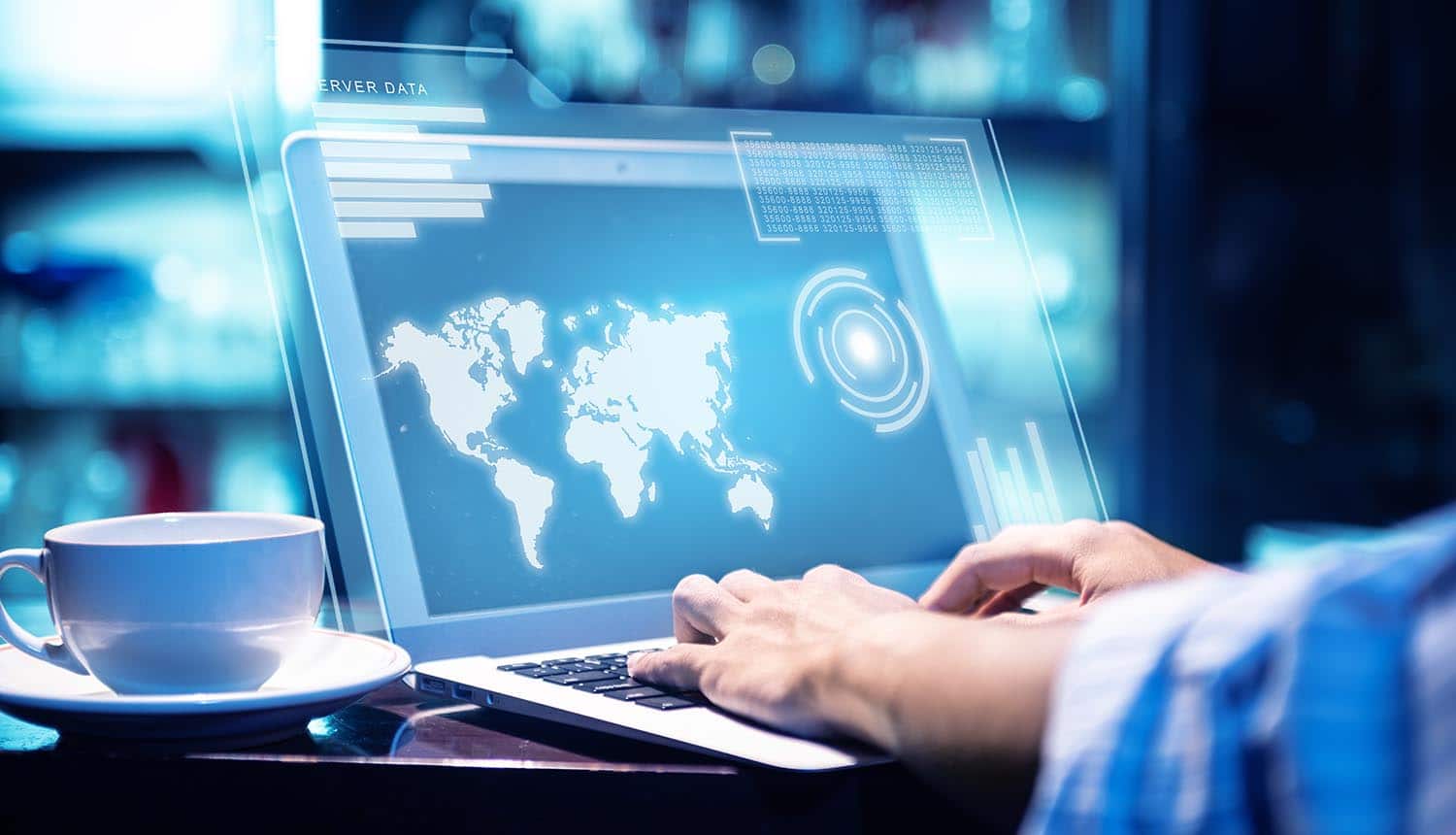 Man working using laptop with virtual screen displaying world map showing impact of new DNS vulnerabilities