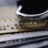 Credit cards with a lock showing data breach at carding site