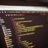 Lines of code visible on a screen showing web application security
