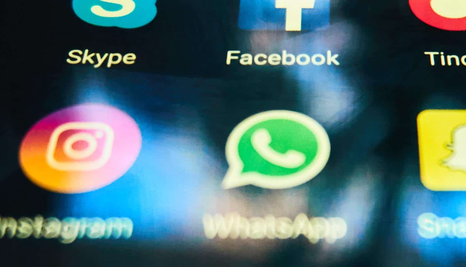 WhatsApp app icon on smartphone showing consumer complaints on privacy update