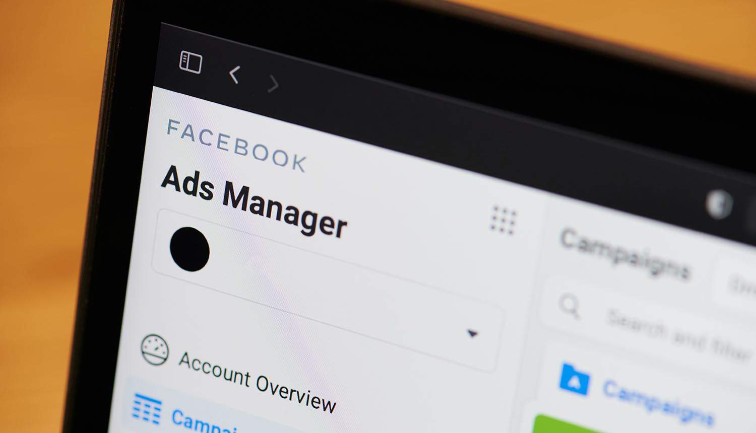 Facebook ads manager tool on laptop screen showing Facebook ad performance after iOS privacy update