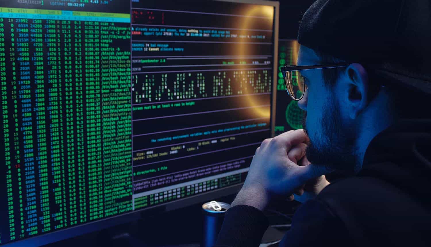 Man looking at metrics on computer screen