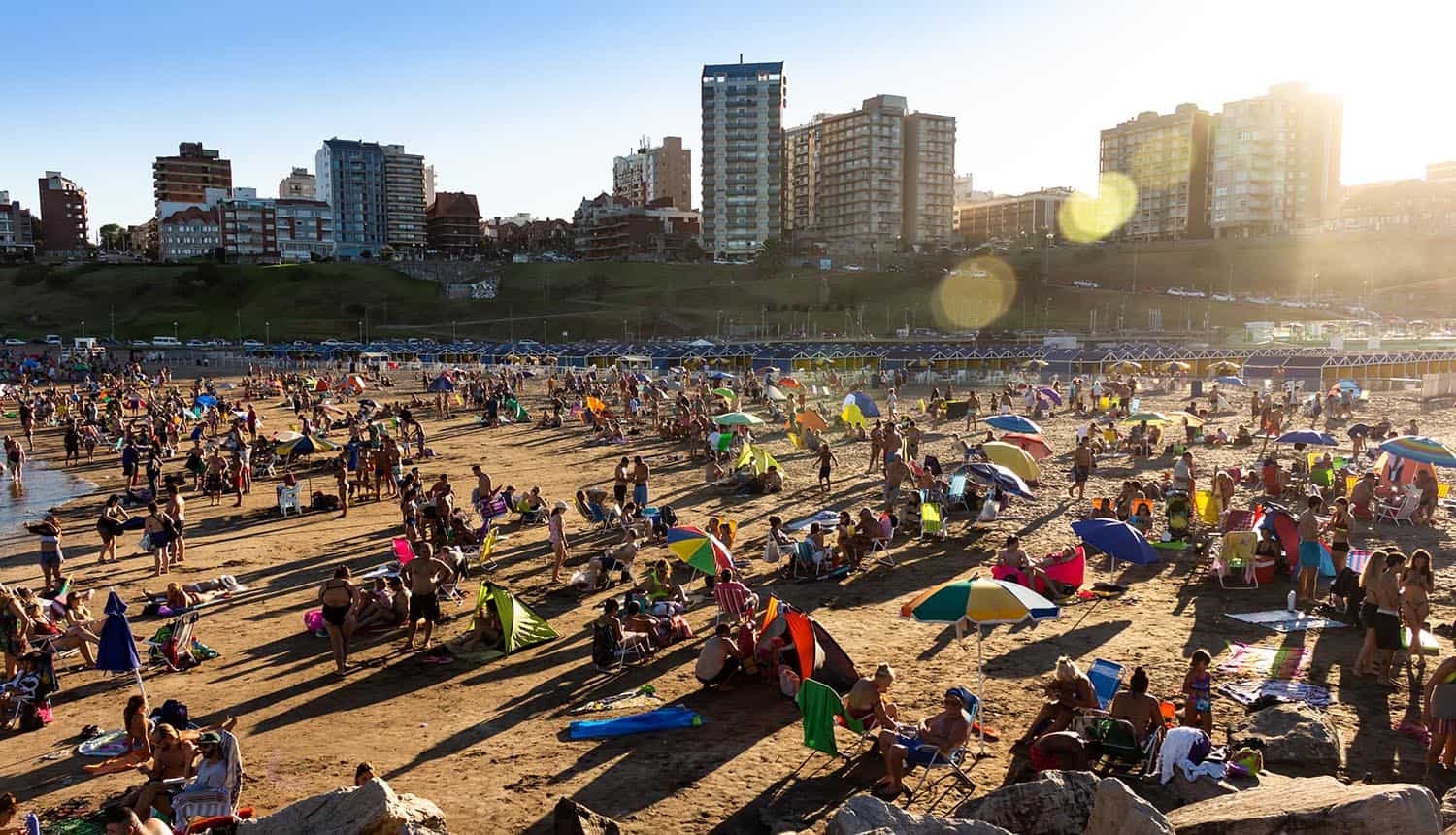 Hundreds of Argentina citizens at the beach during a sunny day showing data breach of government database