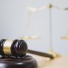 Judge gavel on wooden table showing antitrust regulations impact on legal practitioners