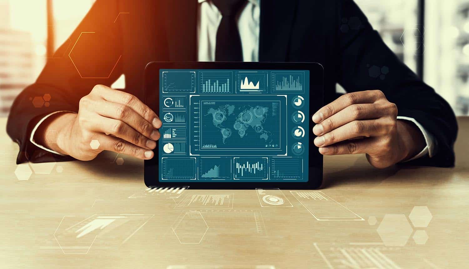 Man holding tablet with metrics and graph showing risks for information assets