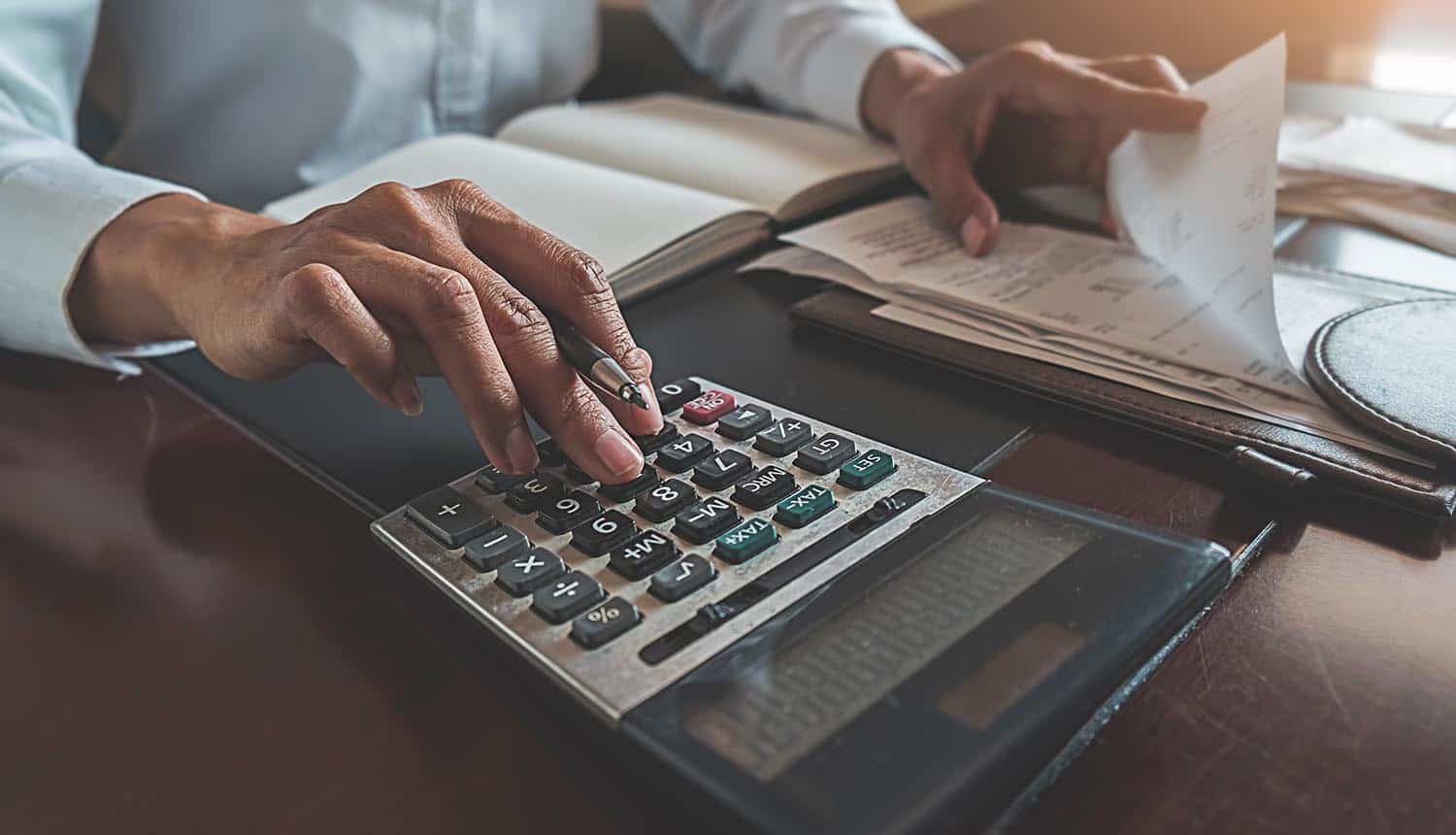 Woman with bills and calculator
