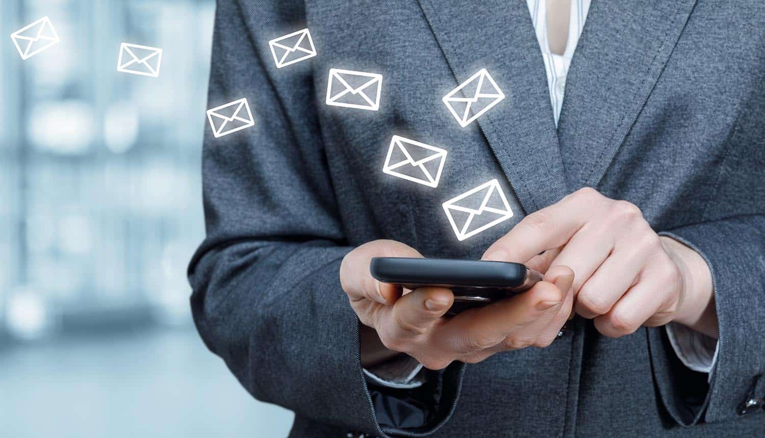 Business woman using email on a mobile device showing email security