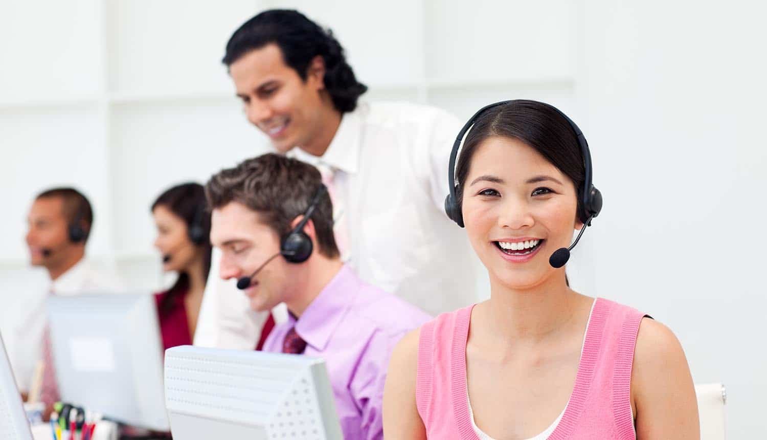 Customer agent and her team in a call center