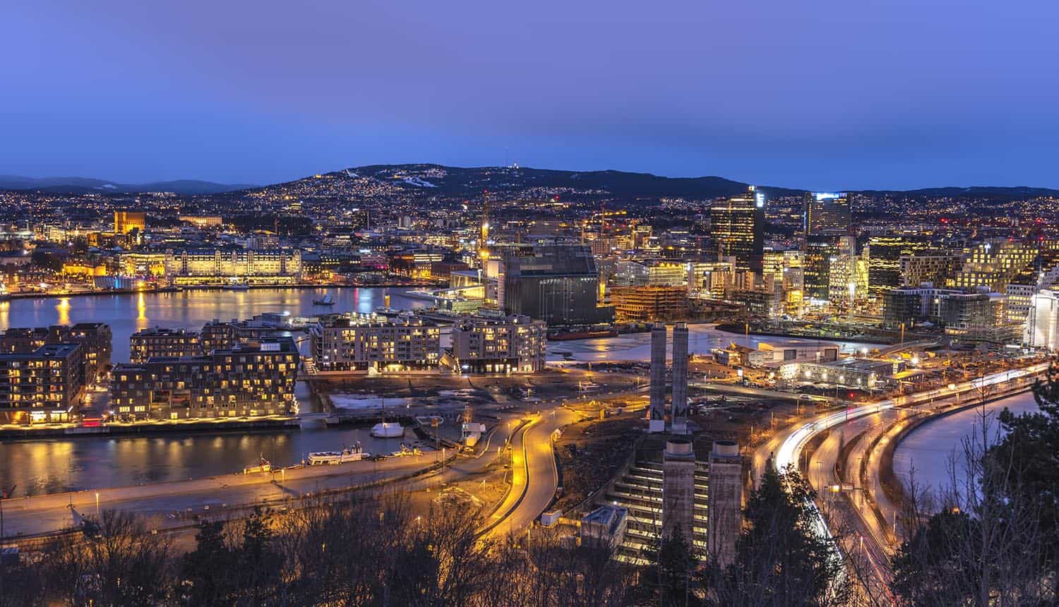 Oslo night aerial view city skyline at business district showing cyber attack on media company