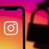 Instagram logo on a smartphone with a security padlock showing hacked Instagram accounts