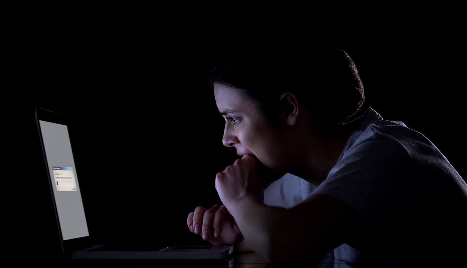 Nervous woman waiting for files downloading