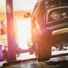 Car in garage of auto repair service shop showing ransomware attack on Japan automotive supplier