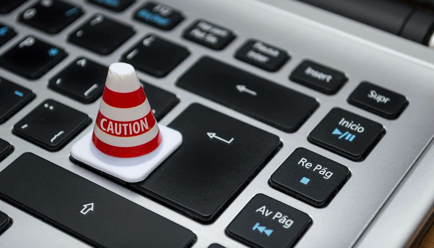 Caution cone on laptop keyboard