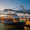 Freight boat in cargo port showing reporting of cyber incidents for critical sector