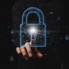 Businessman chooses the padlock icon showing cyber resilience