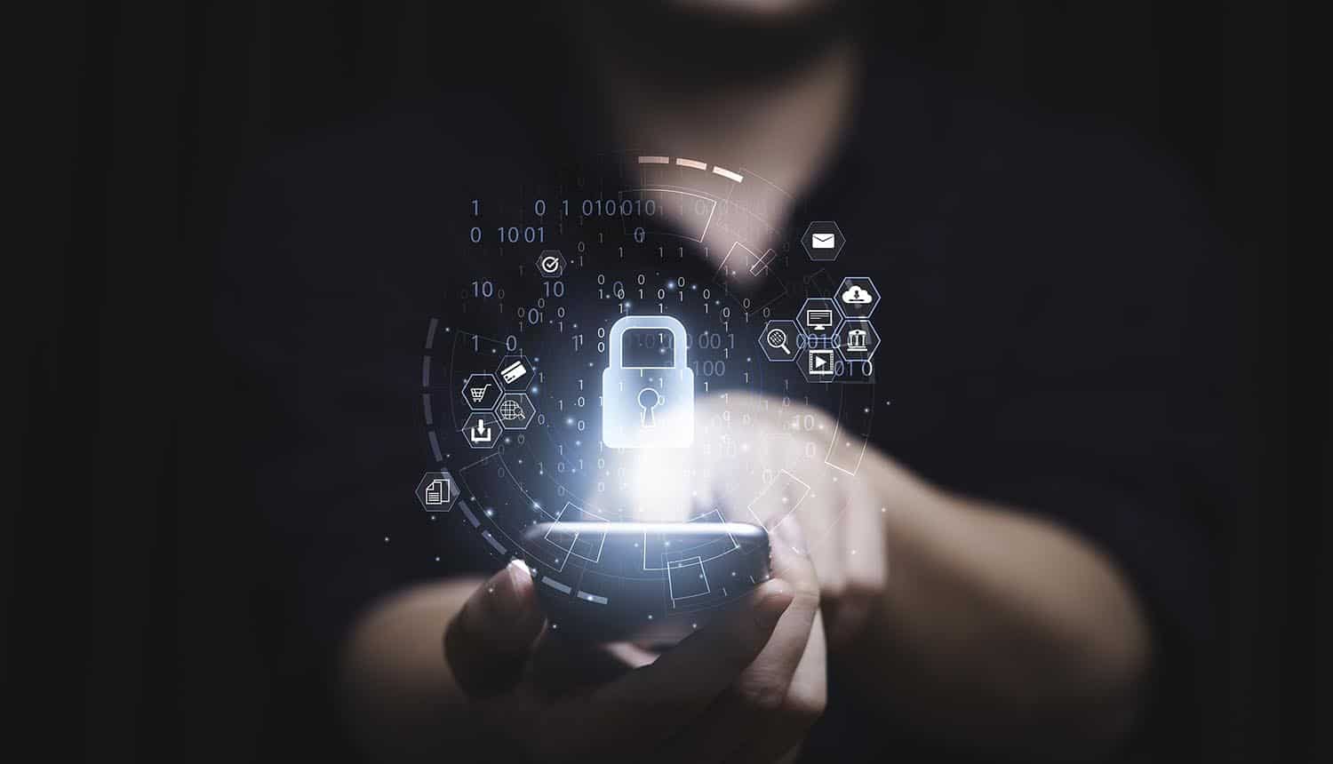 Hand touching screen of smartphone showing cyber defense