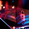 Man typing on laptop with login and lock showing privileged access management