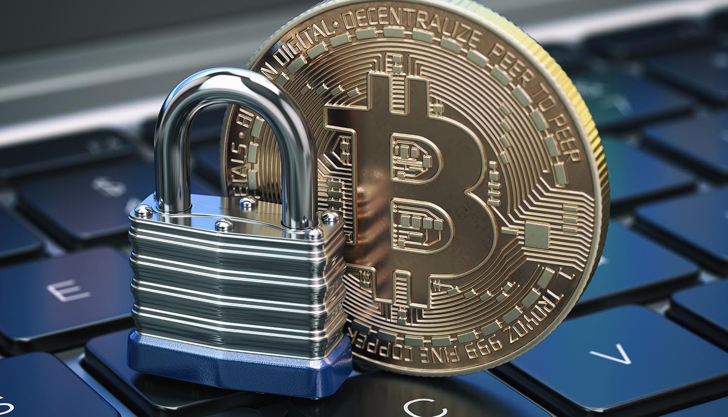 Cryptocurrency bitcoin coin and padlock lock on computer keyboard