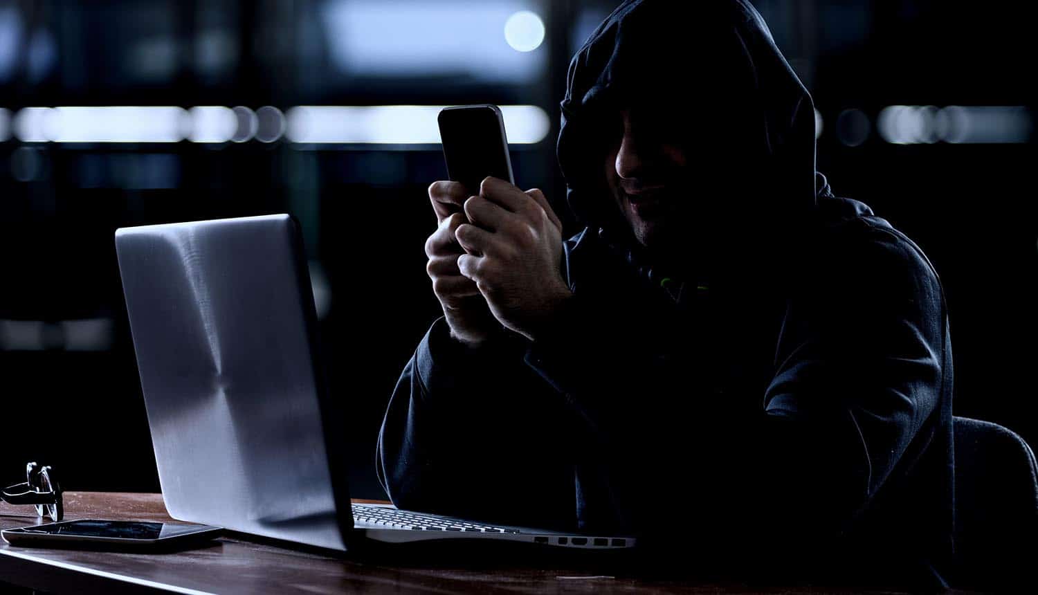 Hacker using a smartphone