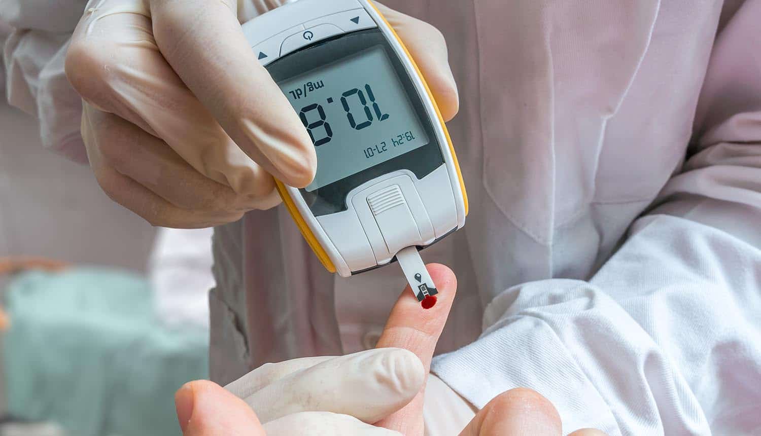 Doctor monitoring patient using medical devices showing internet of medical things