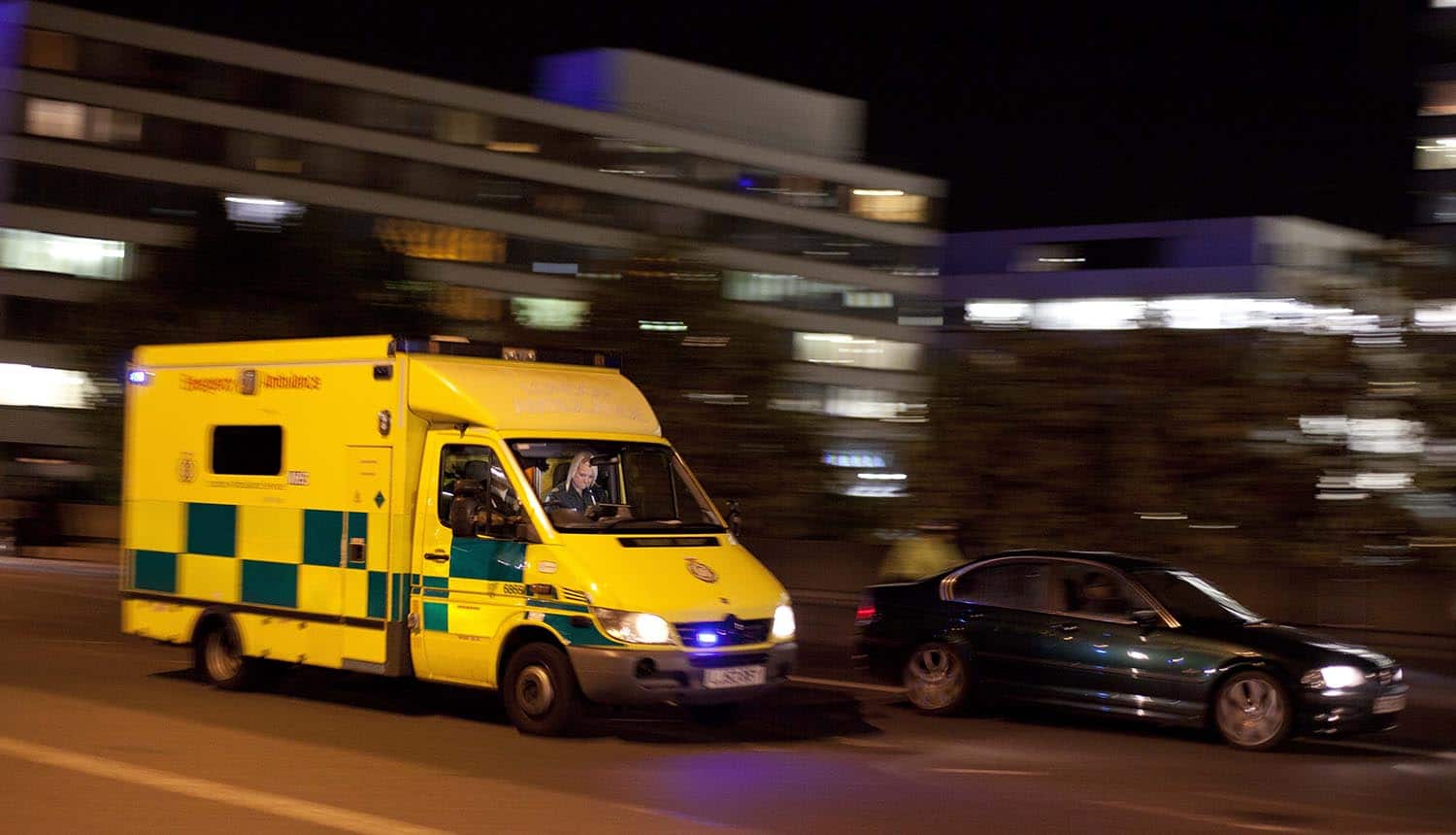 London emergency ambulance responding at night showing cyber attack on NHS 111 caused system outage