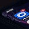 Coinbase mobile app on smartphone screen showing challenge on US Treasury sanction on Tornado Cash crypto mixer
