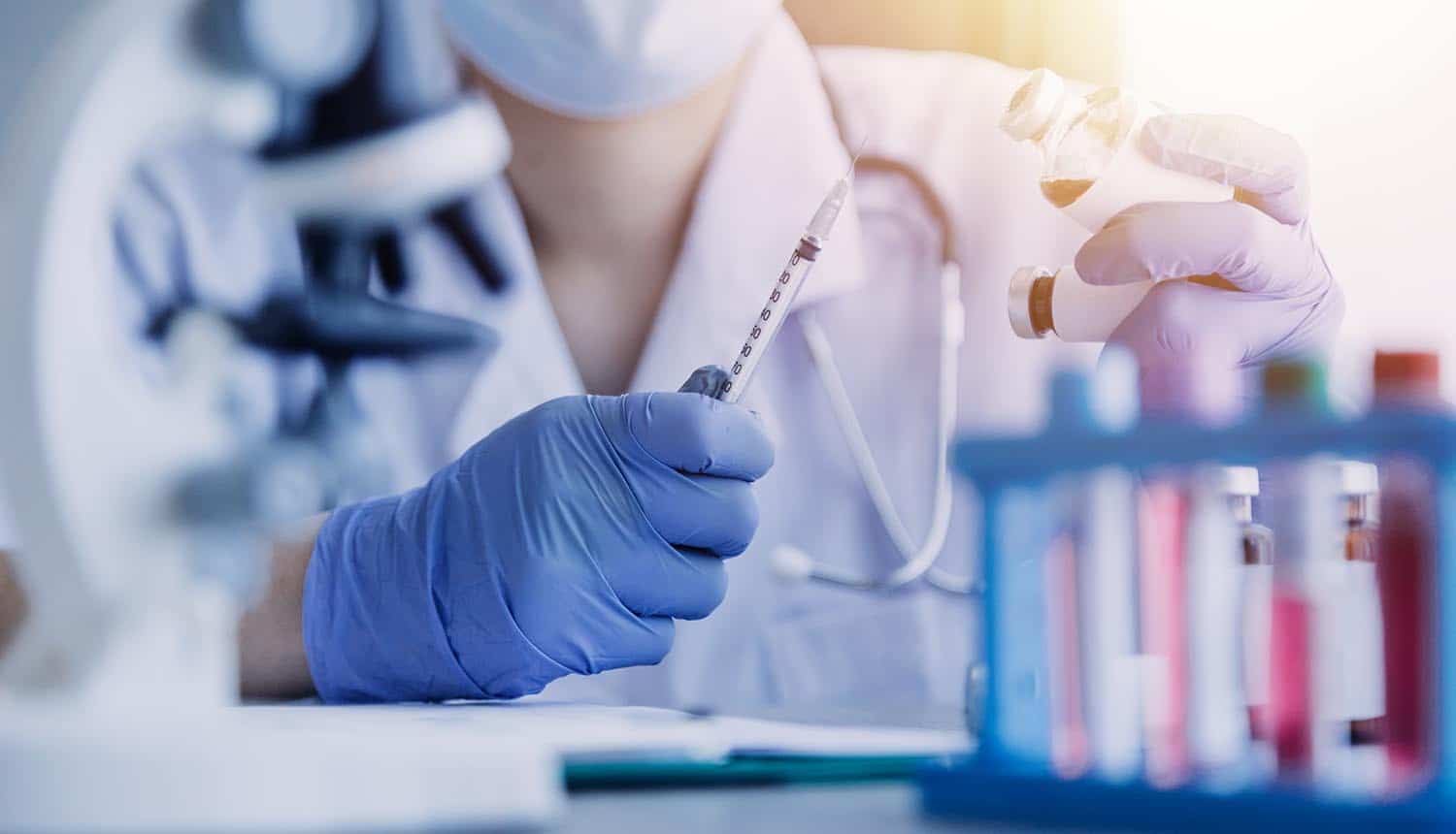 Clinical labs team working with microscope showing stolen patient data on dark web due to data breach
