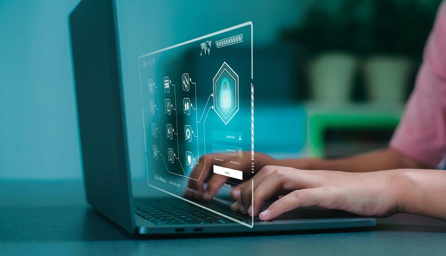 Woman typing code to access a laptop