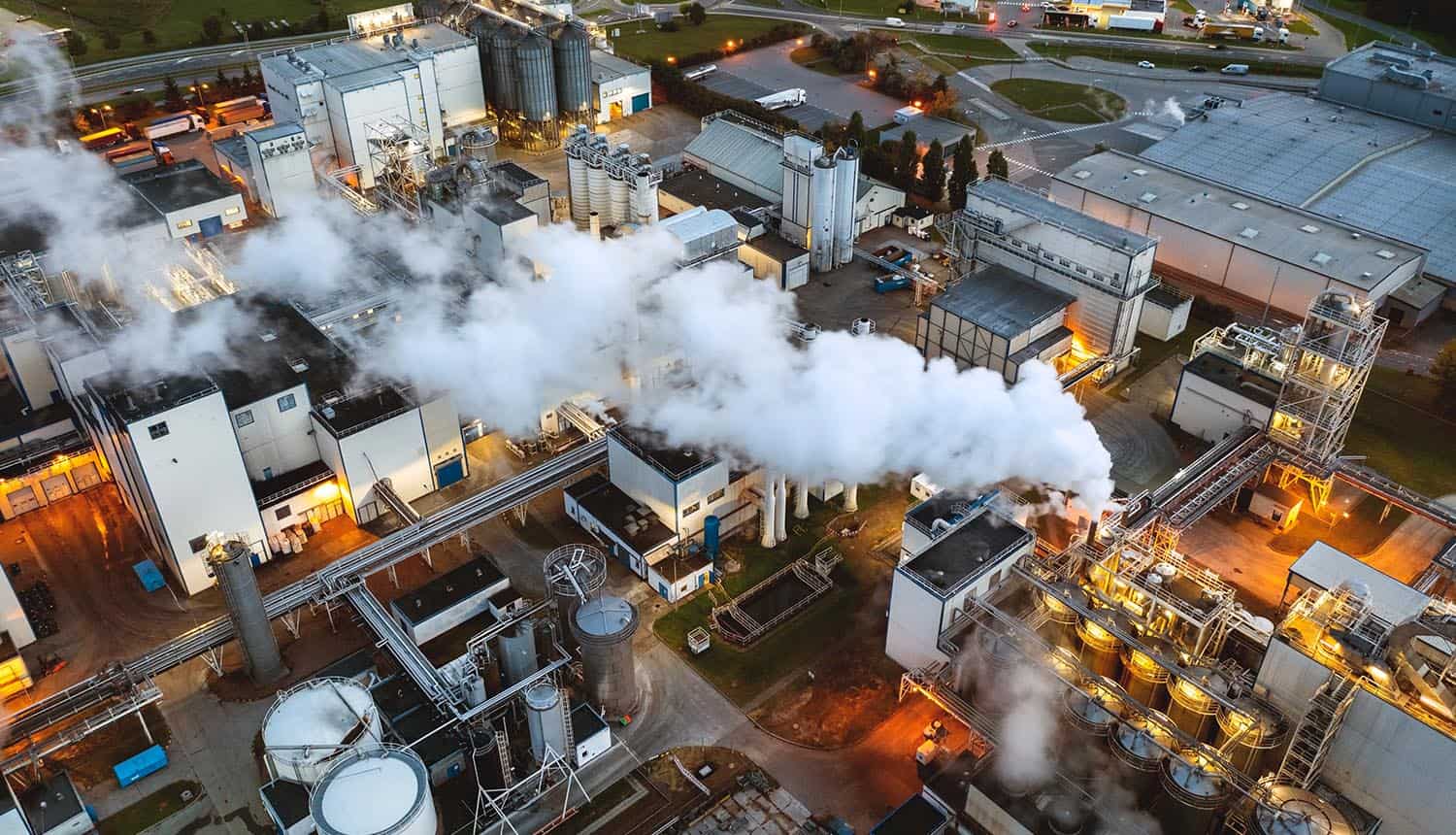 Top view at night on an oil refinery showing cyber-physical OT security of critical infrastructure