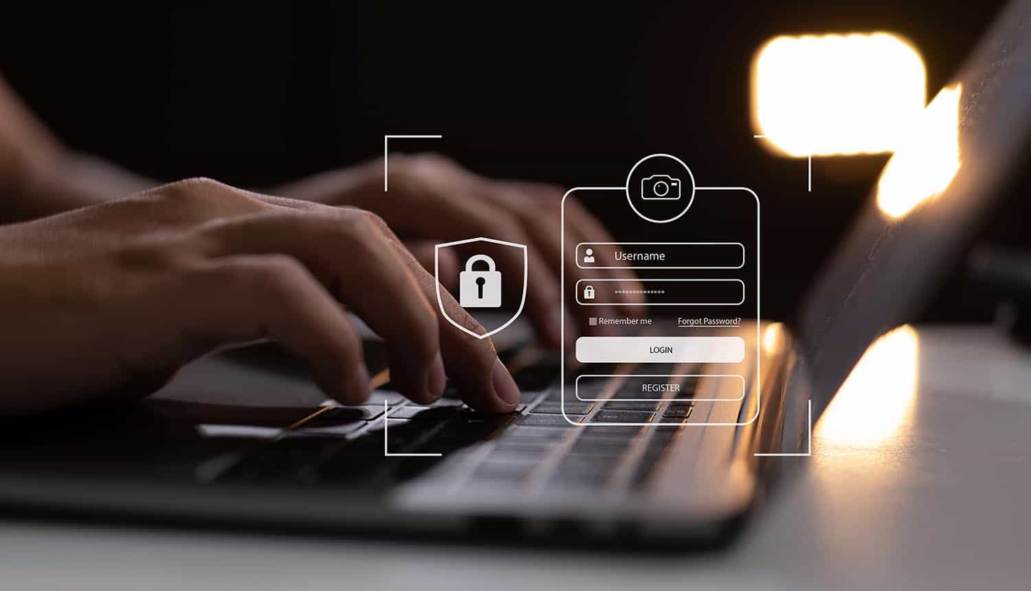 Man typing on laptop with virtual login screen